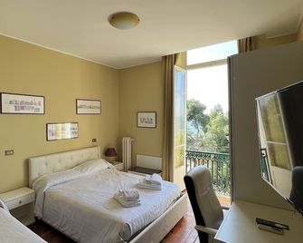Hotel Petit Royal - Ospedaletti - Спальня