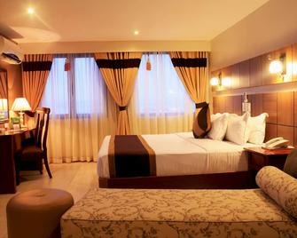 The Pinnacle Hotel and Suites - דבאו - חדר שינה