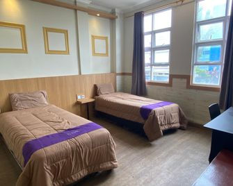 Take Guesthouse 2 - Jambi - Slaapkamer