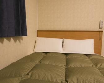 Hotel Econo Yokkaichi - Yokkaichi - Schlafzimmer