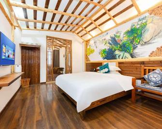 Hotel California Zhangjiajie - ג'אנגג'יאיי - חדר שינה