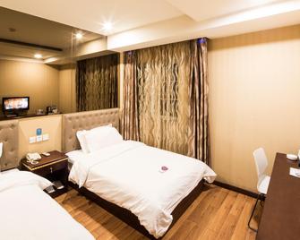 Hanting Express Tianjin Heping Road - טיאנג'ין - חדר שינה