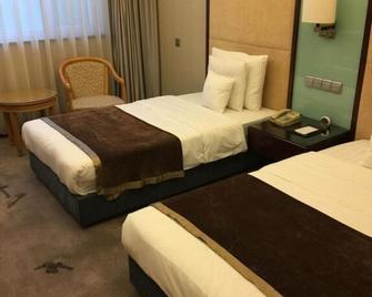 Jinnian Hotel - Jincheng - Habitación