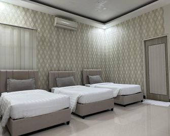 Zhouse Hotel - Lhonga - חדר שינה