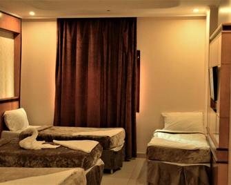 Al Fajr Al Badea 1 Hotel - Mecca - Bedroom