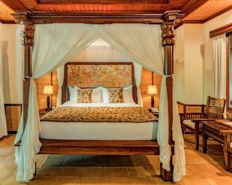 سري فالا ريزورت آند فيلا - دنباسار - غرفة نوم