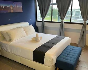 Cassia Inn Kuching - Kuching - Schlafzimmer