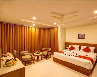 Hotel Floral Park - Kottayam - Спальня