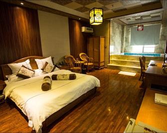 Meilan Hot Spring Hotel - Ан-Шун - Спальня