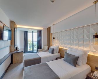 Signature Blue Resort - קושאדסי - חדר שינה