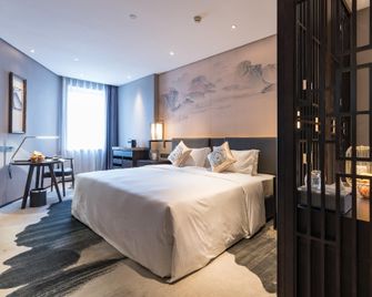 Rezen Dong Hotel Harbin Ice & Snow World - هاربين - غرفة نوم