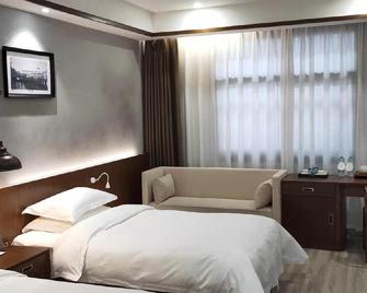 Juhongsheng Holiday Hotel - Huainan - Schlafzimmer