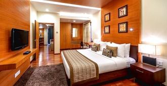 Kenilworth Hotel, Kolkata - כלכולתה - חדר שינה
