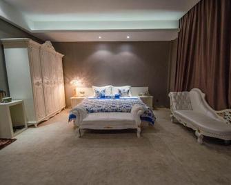 Yikezhan Boutique Hotel - Fuxin - Camera da letto