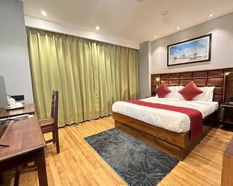 Numinous Hotel - Thimphu - Schlafzimmer