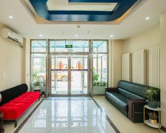 7 Days Inn Harbin Xianfeng Road Xilong Market Branch - Harbin - Reception