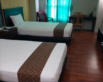 Corner Palace Hotel - Ternate - Habitación