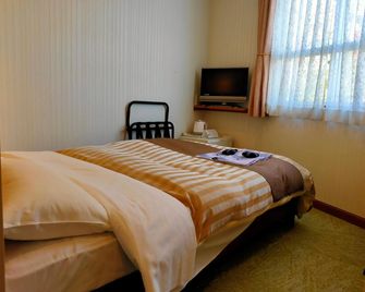 Beppu Station Hotel - Beppu - Sovrum