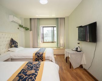 Jingdezhen Jingsheng Hotel - Jingdezhen - Bedroom