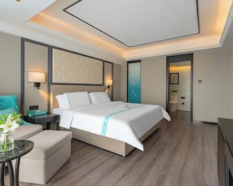 Xana Hotel Qionghai Municipal Government High-Speed Railway Station - Qionghai - Bedroom