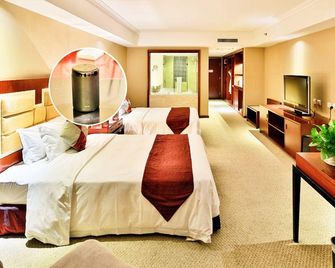 Rich Gate Hotel - Shenyang - Schlafzimmer