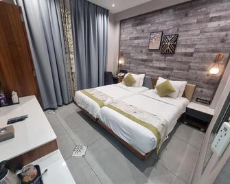 Rg Exclusive Hotel-Akola - Akola - Bedroom