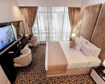 Cairo Taj Hotels & Suites- Mohandessin - קהיר - חדר שינה