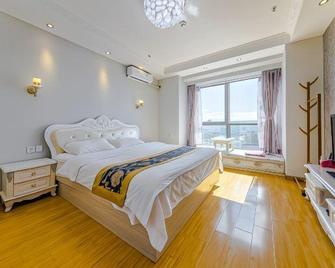 Zhiyuan Holiday Apartment - Weihai - Schlafzimmer