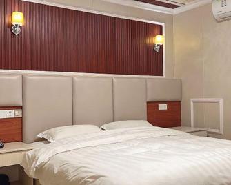 Shunda Business Inn - Xuancheng - Bedroom