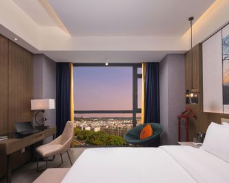 Dongbao Hotel - Chuxiong - Habitación