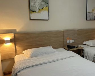 7 Days Inn Shangqiu Minzhu Road Walmart Branch - Shangqiu - Спальня