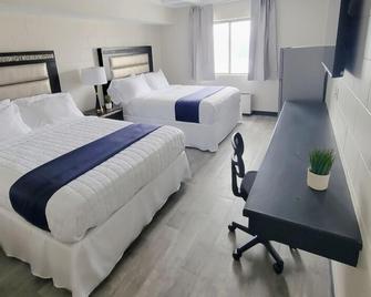 Guest Lodge - Minot - Bedroom
