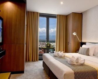 هوتل بانوراميكا - سكوبي - غرفة نوم