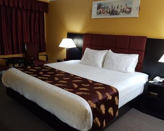 Alpine Inn & Suites - רבלסטוק - חדר שינה