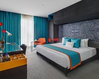 Triton By Shyama Hotels & Resorts - Raipur - Slaapkamer