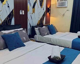 Our stylish condo is designed to make your stay memorable and relaxing. - Manila - Bedroom