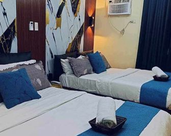 Our stylish condo is designed to make your stay memorable and relaxing. - Manila - Schlafzimmer