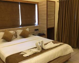 Hotel New Golden Veena - Mount Abu - Slaapkamer