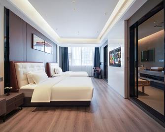 Xingwei Hotel - Le-šan - Ložnice