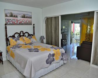 Sundrenched Spaces 1-bedroom apartment in lovely Montego Bay with WiFi, AC - Bahía Montego - Habitación