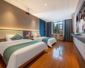 Nanning Qiyueli Hotel - Nanning - Schlafzimmer