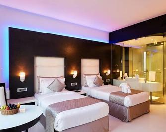 Muzahotels At Eskay Resorts - Mumbai - Bedroom