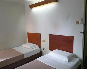 Lea Phing Inn - Bintulu - Bedroom
