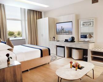 بنان للأجنحة الفندقية - تبوك - غرفة نوم