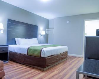 Days Inn & Suites by Wyndham Athens Alabama - Athens - Bedroom