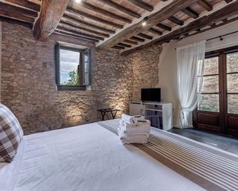 Borgo San Quirico d'Orcia B&B - Capitano Collection - Albergo diffuso - San Quirico d'Orcia - Schlafzimmer