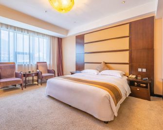 Minghui Huating Hotel - Yan’an - Спальня