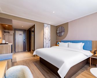 Home Inn Neo Hohhot Railway Station East Street People's Hall Metro Station - הוהוט - חדר שינה