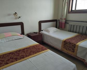 Qufu Shunxing Inn - Jining - Bedroom