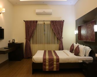 Oriole Resorts - מיסור - חדר שינה